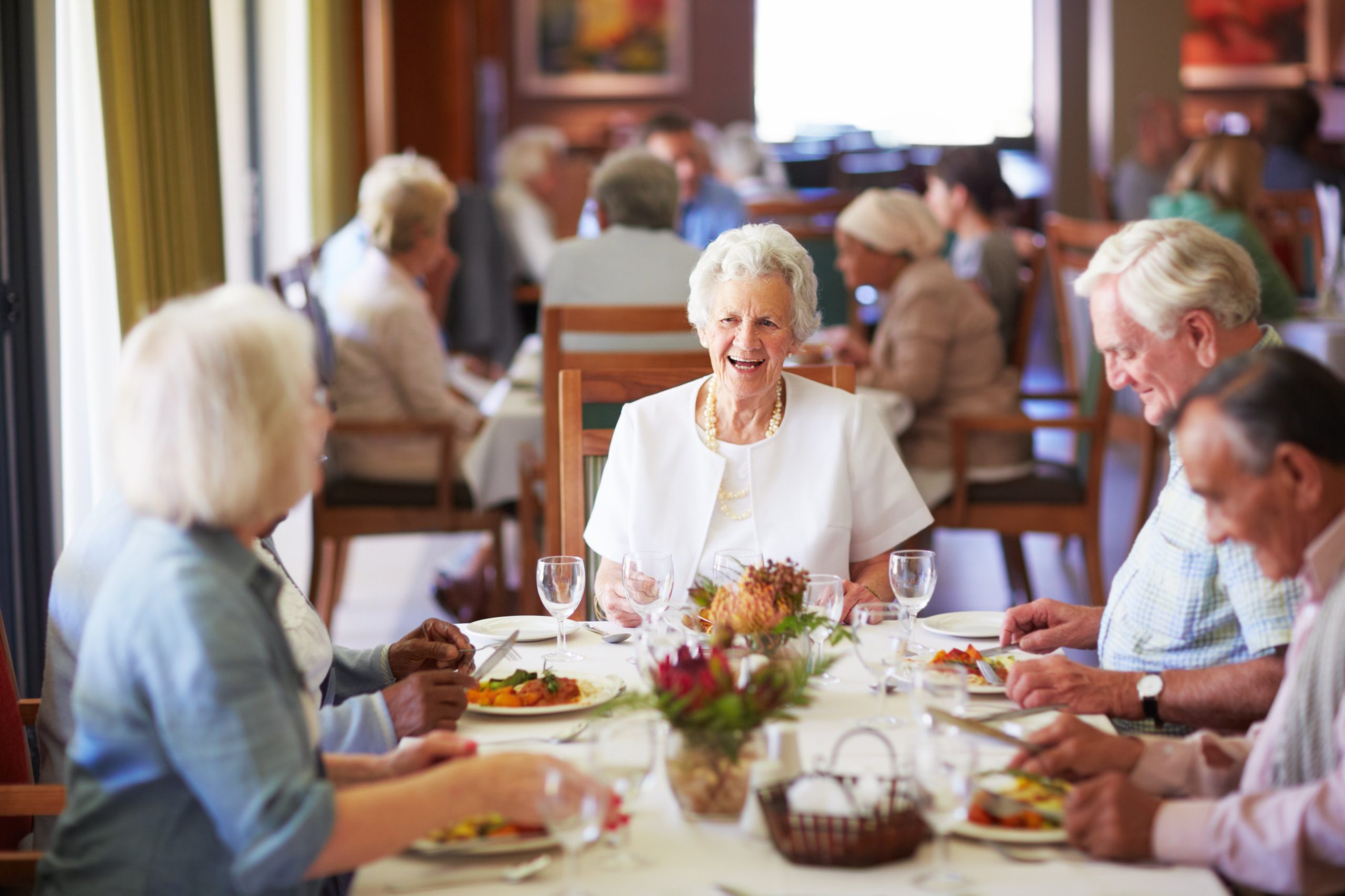 Residents dining together at a table